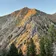 A mountain ridge glowing gold in the evening light